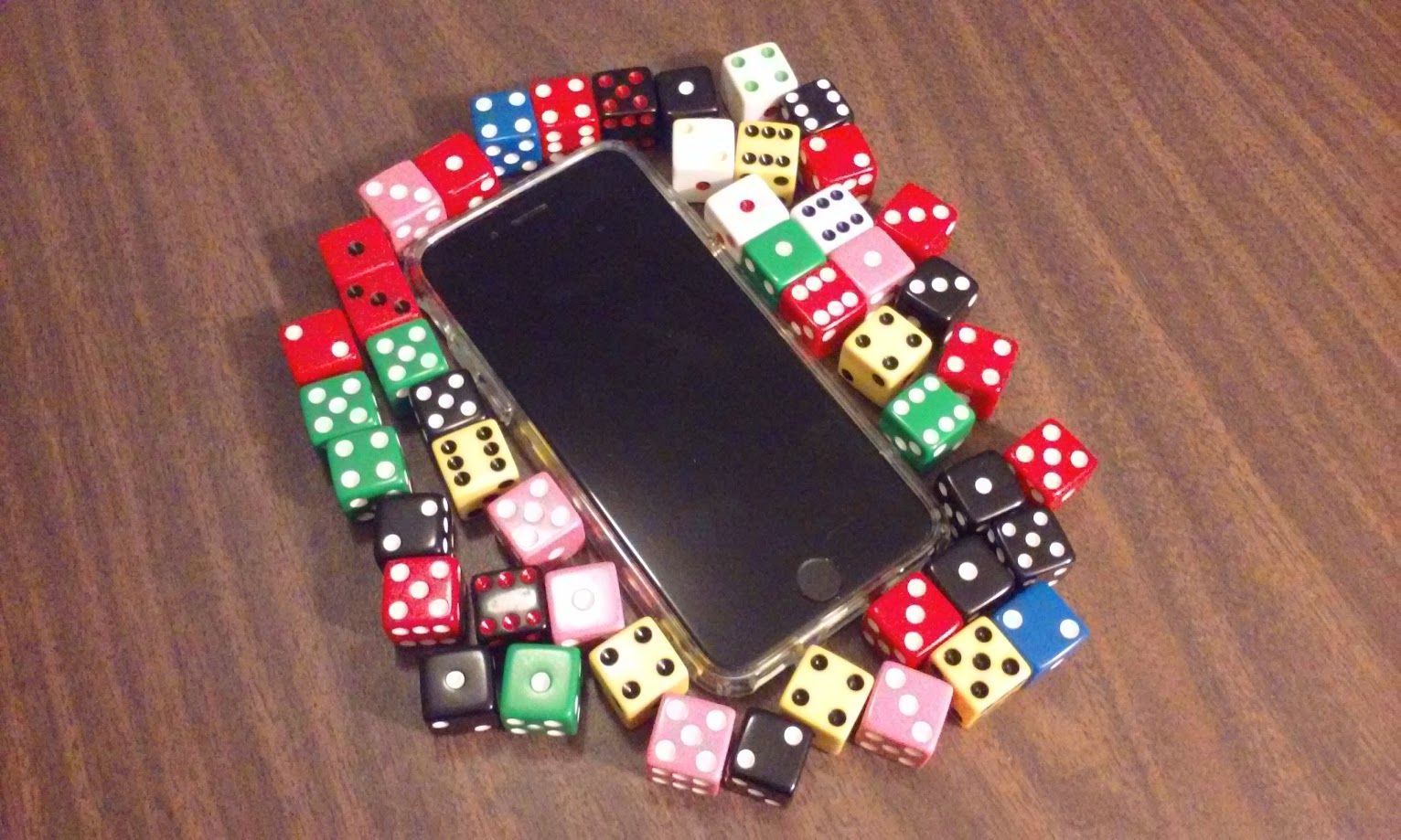 iPhone surrounded by dice